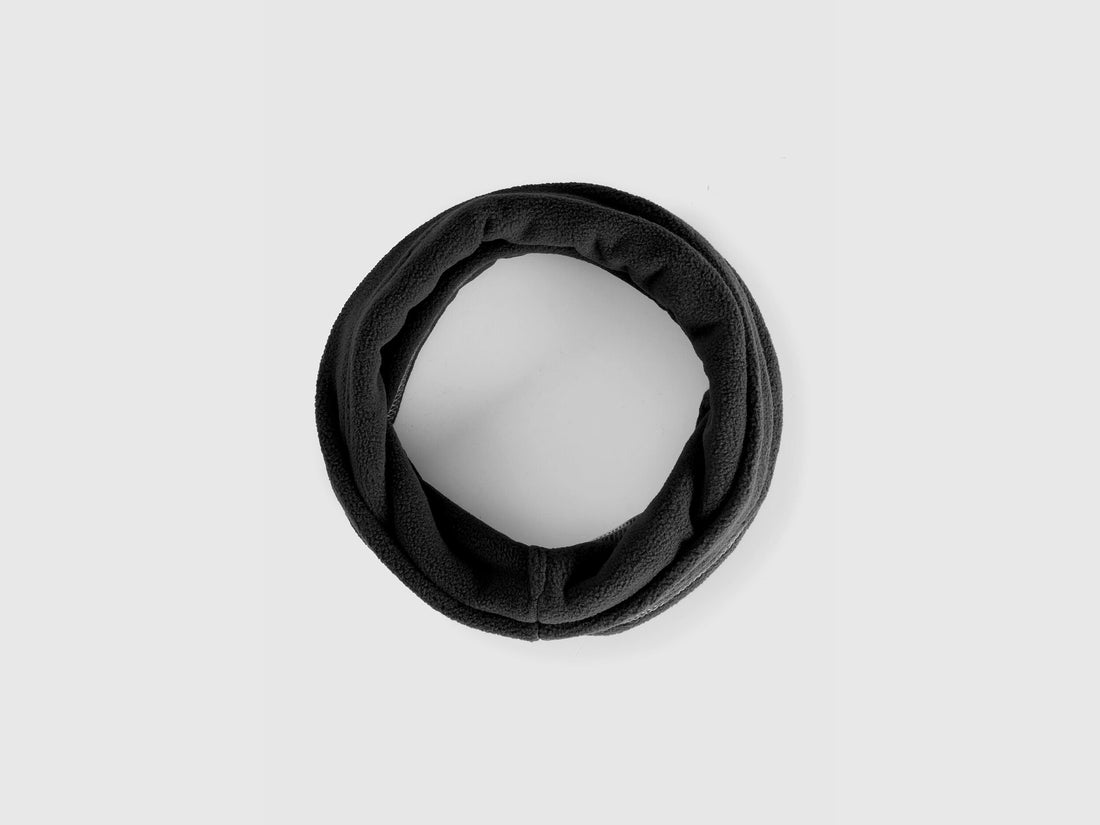 Black fleece neck warmer, rolled for comfort and warmth.