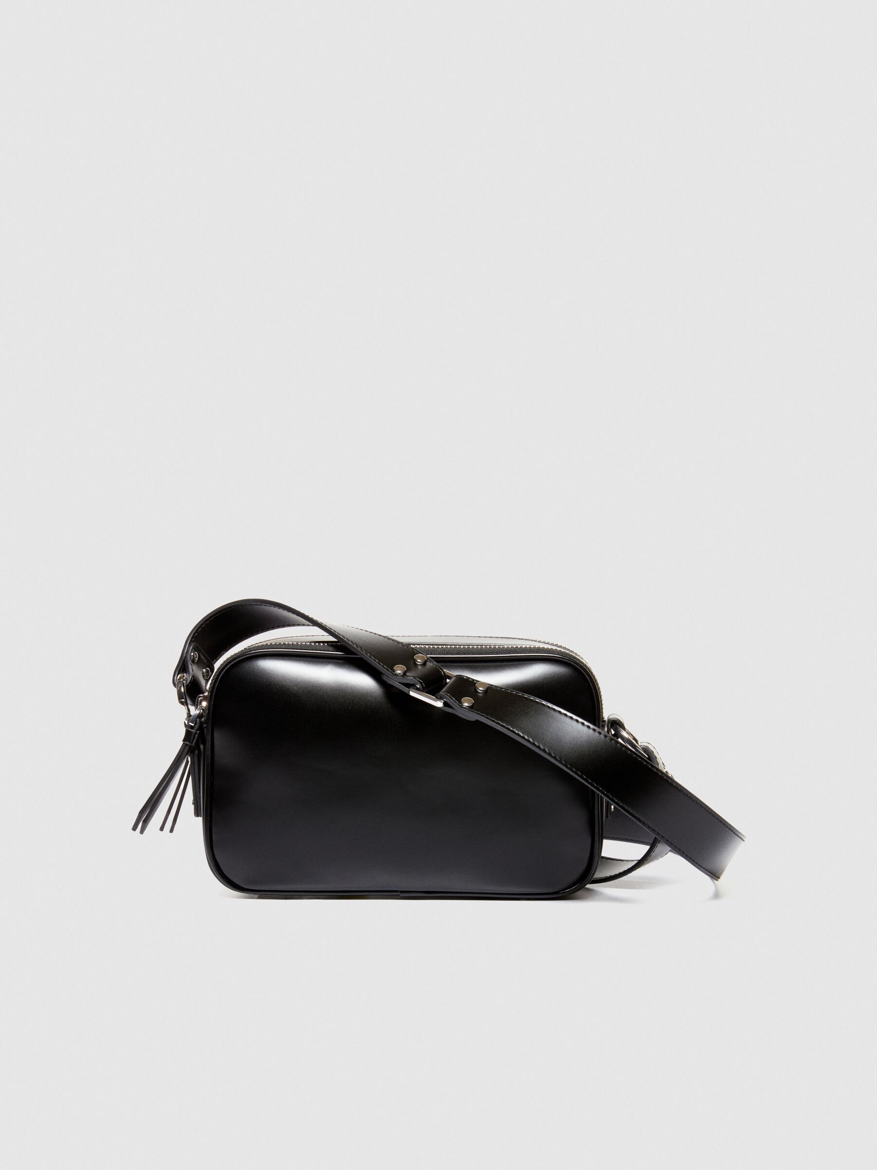 Front view of a sleek black leather camera bag or messenger bag, featuring a main zipper compartment and an adjustable strap.