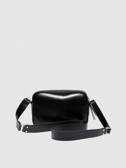 Top-angled view of a black leather camera bag or messenger bag, showcasing its compact design and the width of the strap.
