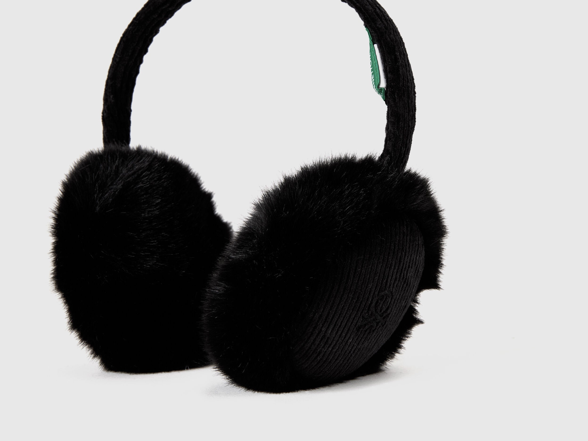 Black synthetic fur earmuffs, close-up view.