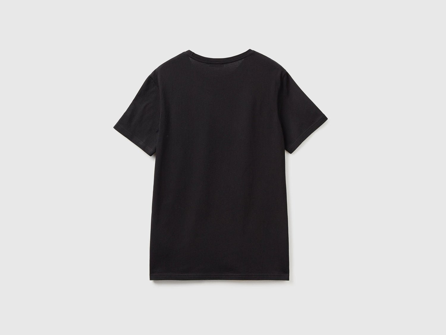 Back view of a plain black t-shirt, displayed on its own with a clean background.