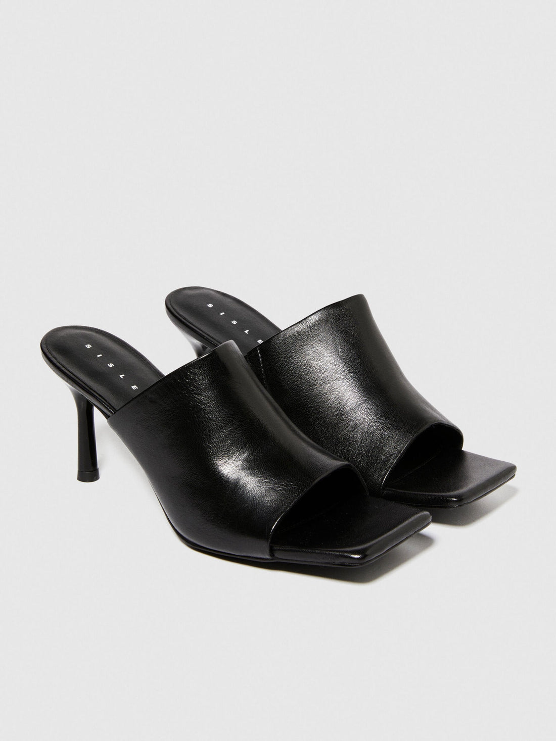 A single black sandal with a chunky platform sole and a wide strap, a fashionable and comfortable choice for sandals for women in Kuwait.