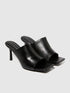 A single black sandal with a chunky platform sole and a wide strap, a fashionable and comfortable choice for sandals for women in Kuwait.