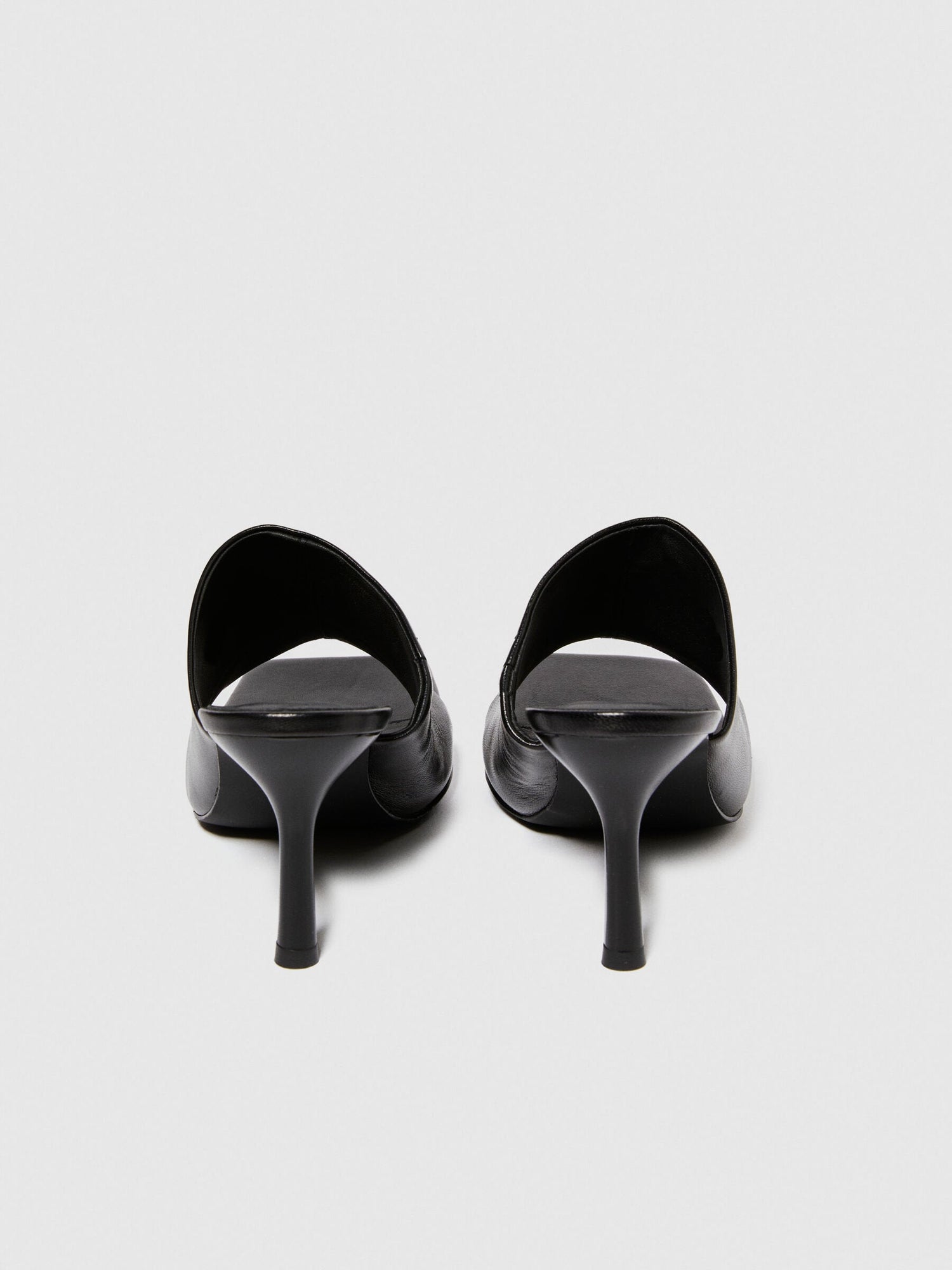 Top-down view of a pair of black sandals for women, highlighting the wide straps and sturdy platform soles, ideal for casual wear in Kuwait.