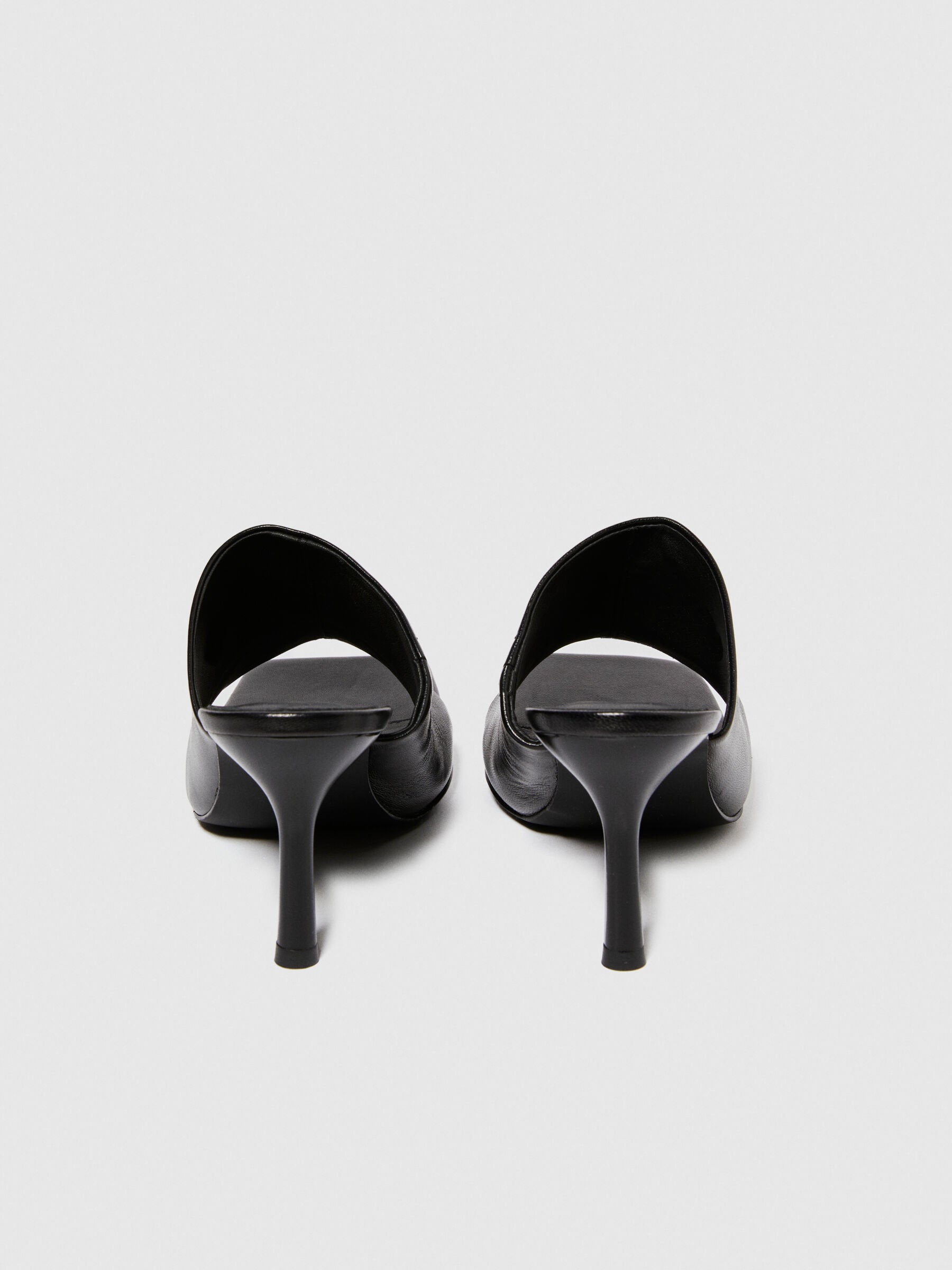 Top-down view of a pair of black sandals for women, highlighting the wide straps and sturdy platform soles, ideal for casual wear in Kuwait.