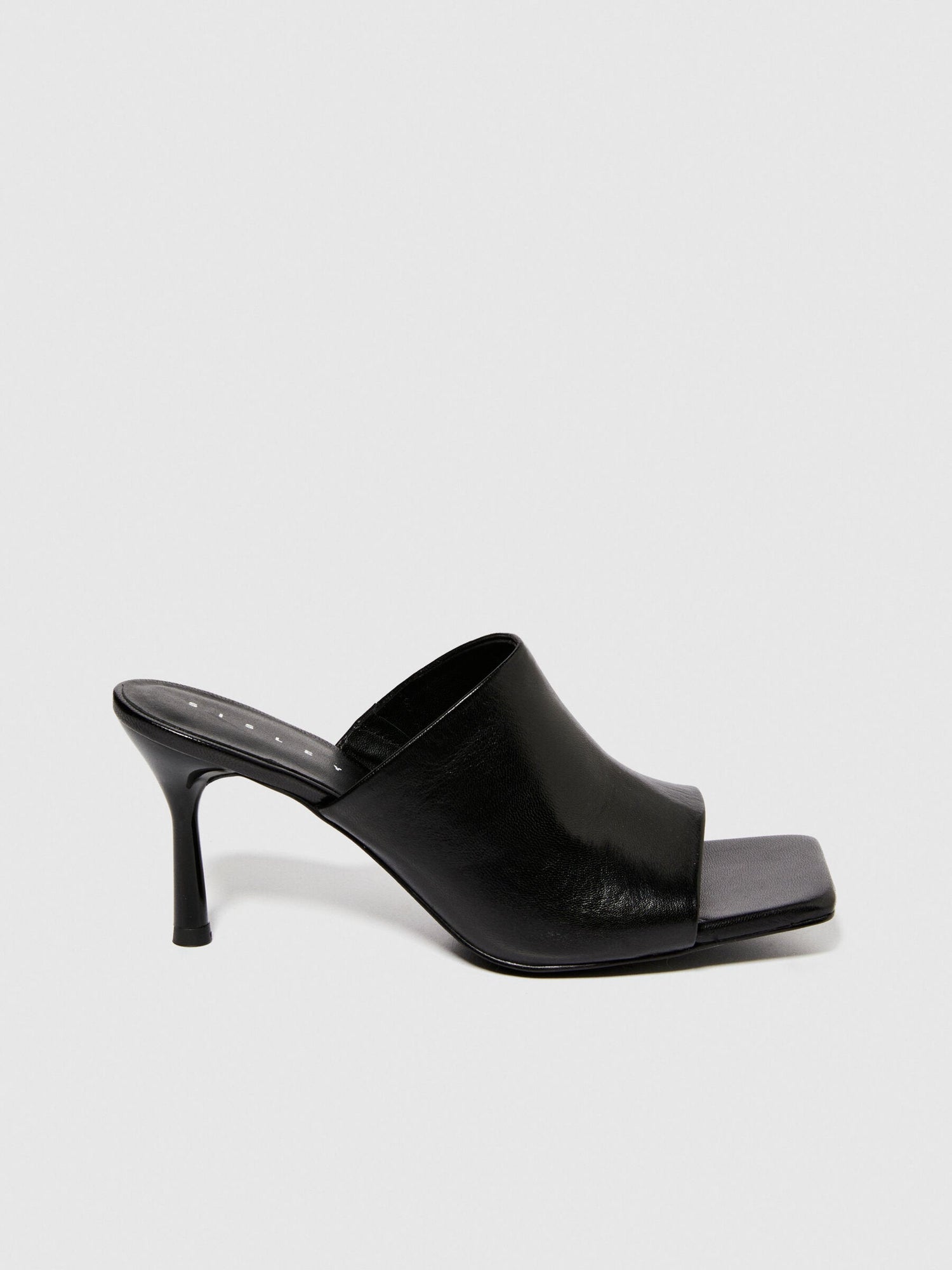 A close-up of the textured rubber sole of a black sandal, showing the non-slip design and durable construction for sandals for women in Kuwait