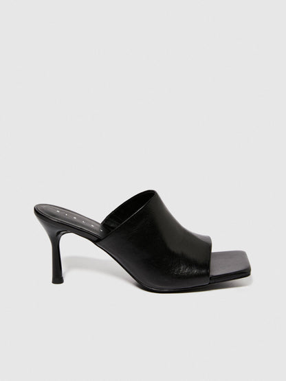 A close-up of the textured rubber sole of a black sandal, showing the non-slip design and durable construction for sandals for women in Kuwait