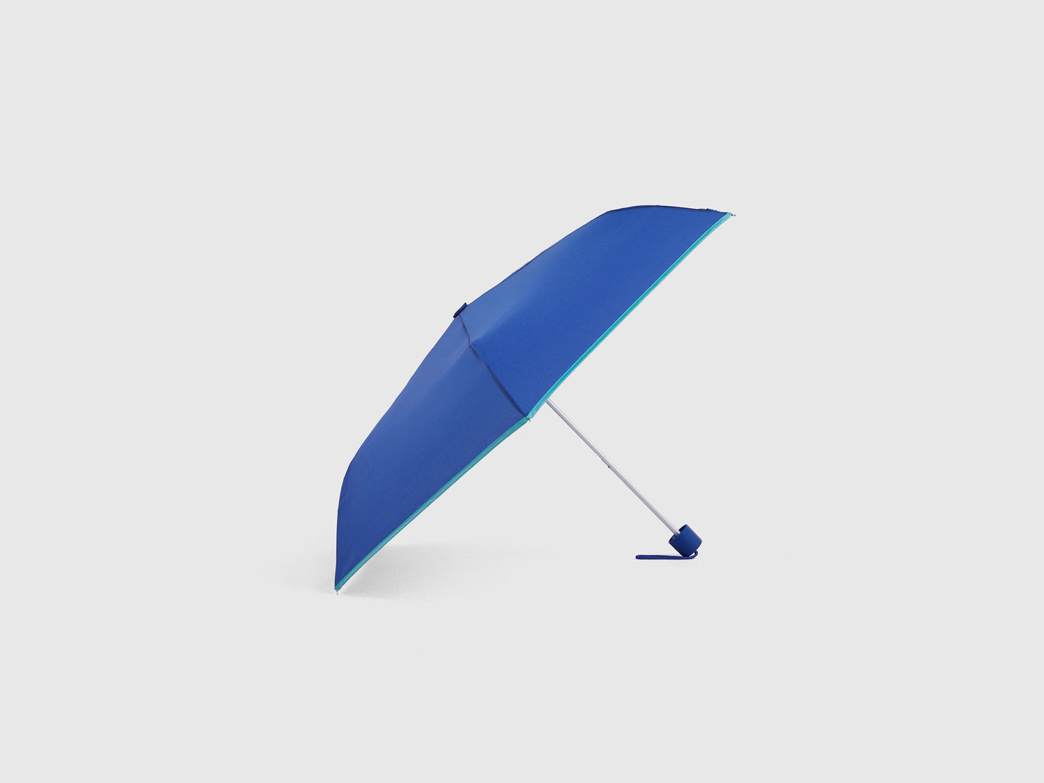 Blue Benetton umbrella, partially open, stylish rain gear.