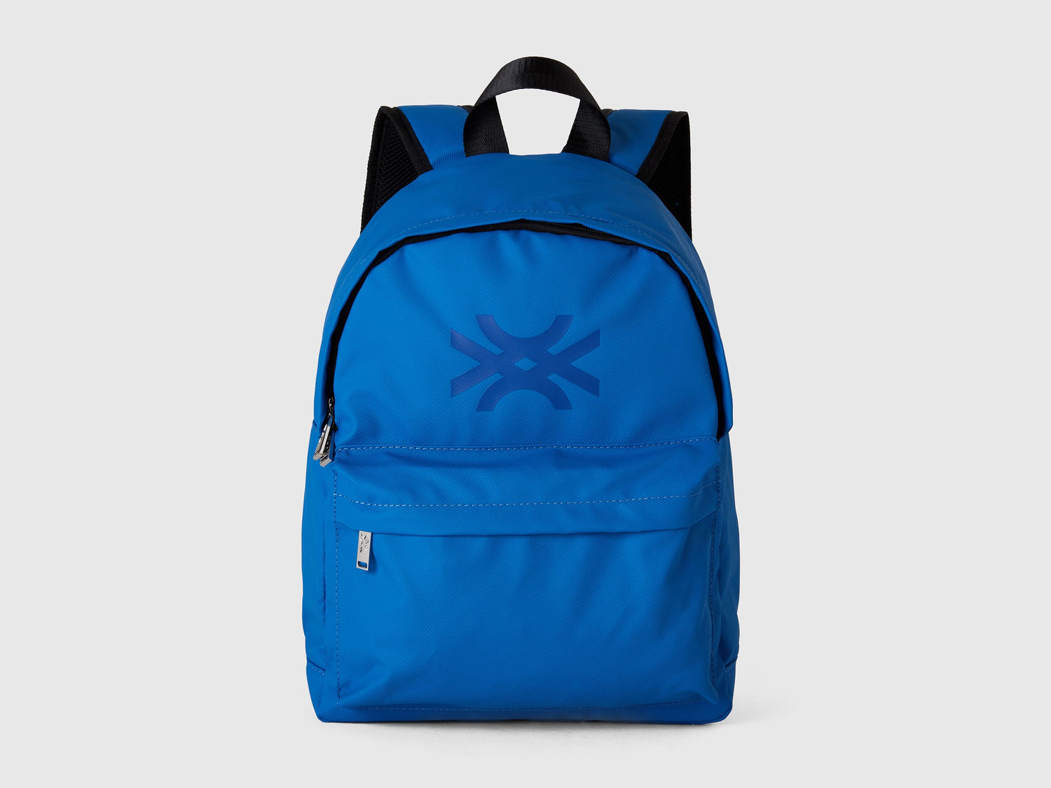 Front view of a vibrant blue nylon backpack with a prominent Benetton logo on the flap.