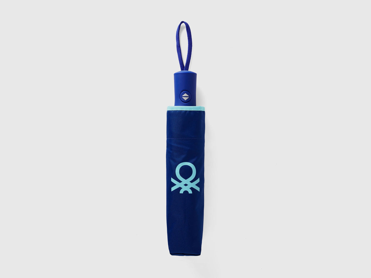 Front view of a blue umbrella, perfect for protection from rain or sun.