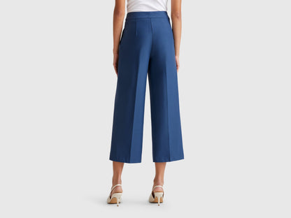 Back view of a female model wearing blue women&