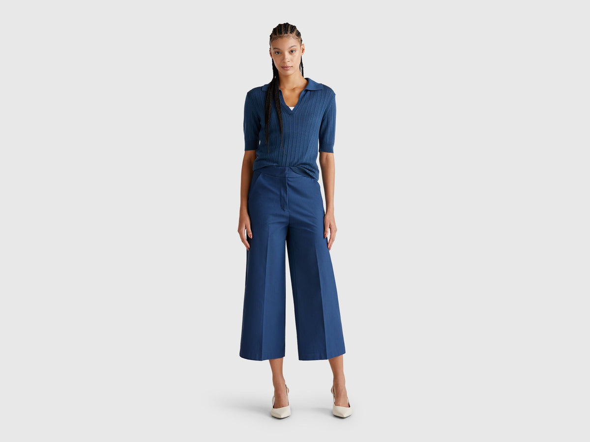 A female model wearing blue women&
