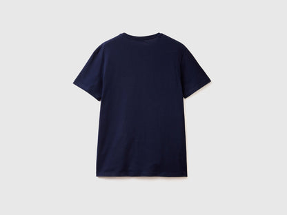 Back view of a plain dark blue short-sleeve t-shirt, flat lay. Basic crew neck tee.