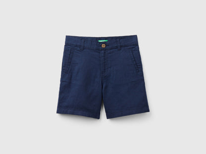  A full, flat lay shot of a pair of dark blue linen blend shorts, viewed from the front.