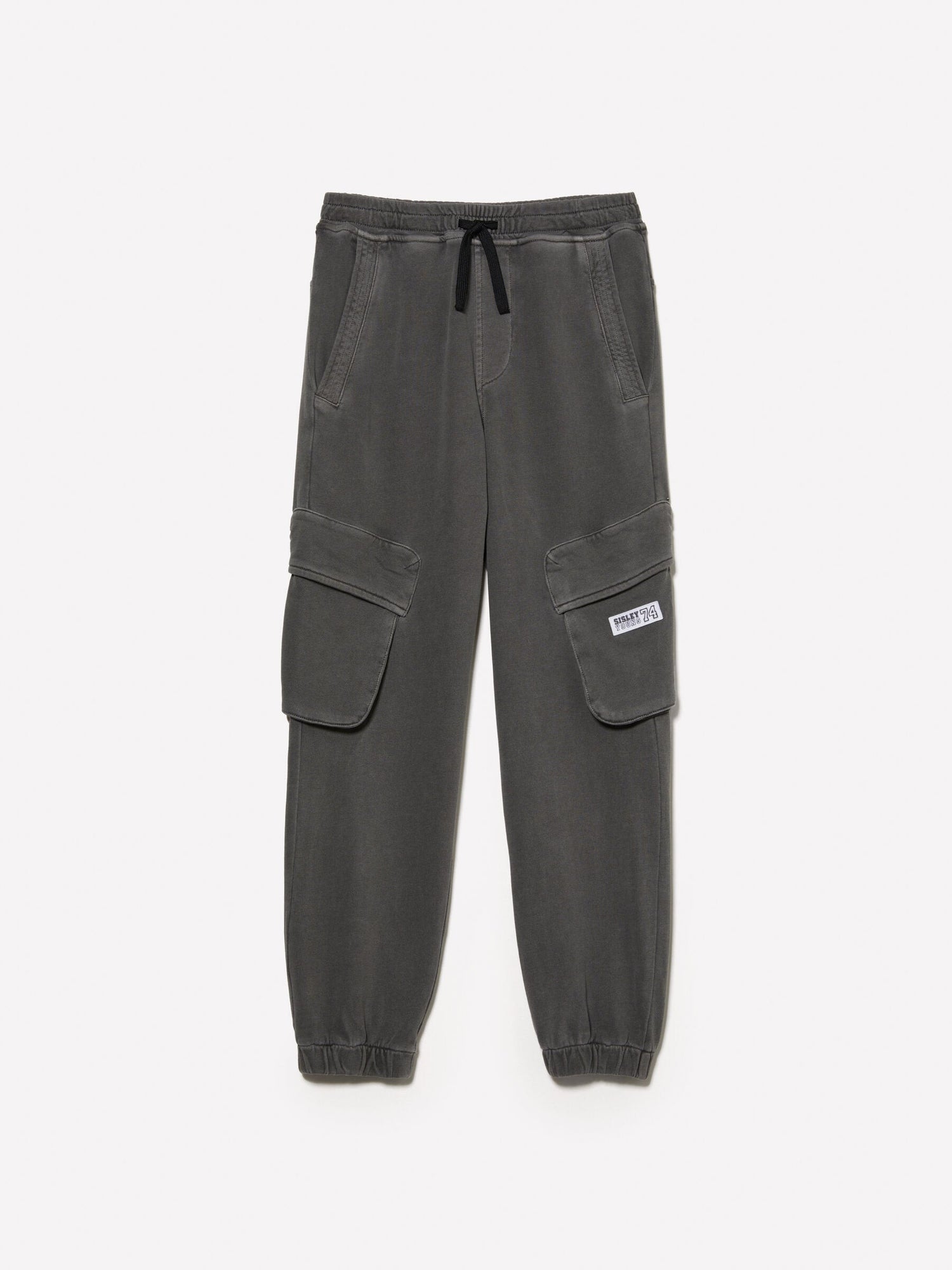 Front view of dark grey joggers with functional cargo-style pockets on the sides and an adjustable drawstring waist, a versatile choice for loungewear or active wear in Kuwait.