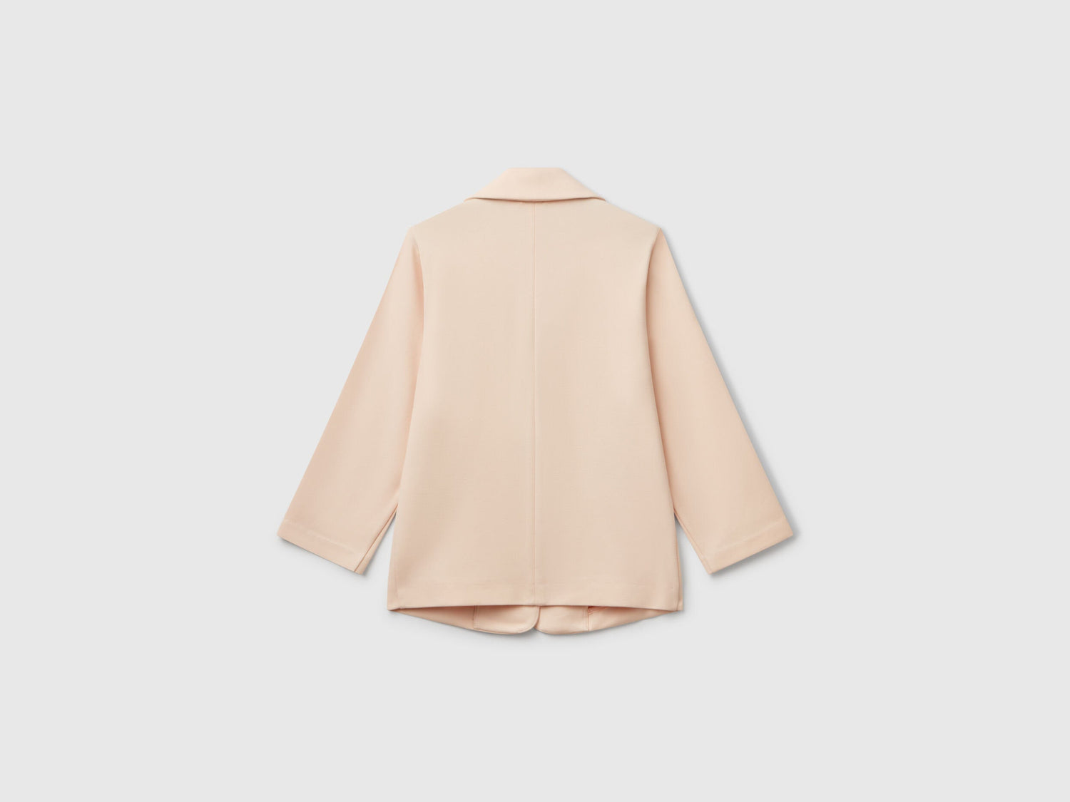 Back view of a sophisticated light peach elegant long blazer for women, showcasing its tailored design, ideal for professional or stylish wear in Kuwait.