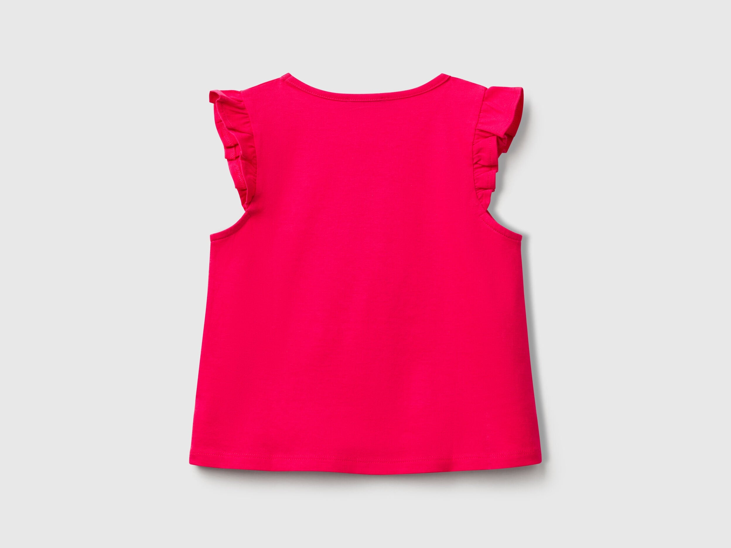 Back view of a plain fuchsia Benetton tank top with delicate ruffle details on the shoulders.