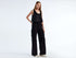 Front view of a pair of stylish cargo pants for girls, with visible side pockets.