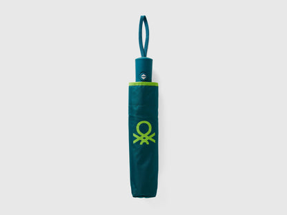 Folded green Benetton umbrella, compact for portability.