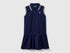 Front view of a navy blue polo dress for kids, featuring a white striped collar and ruffled skirt.