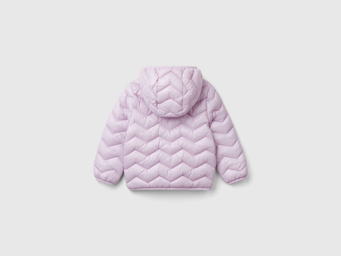 Back view of a light pink padded jacket with a hood for a girl.