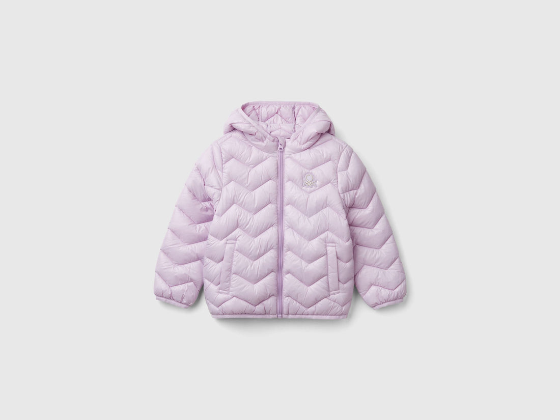 Front view of a light pink padded jacket with a hood for a girl.