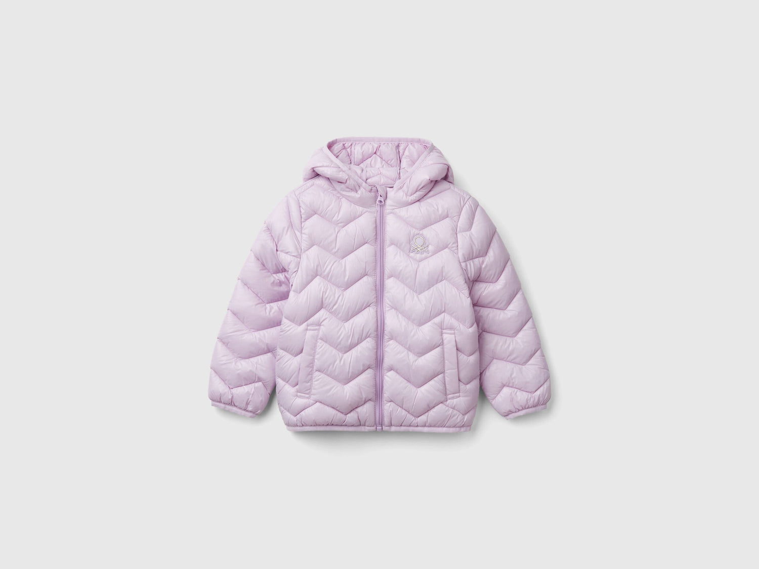 Front view of a light pink padded jacket with a hood for a girl.
