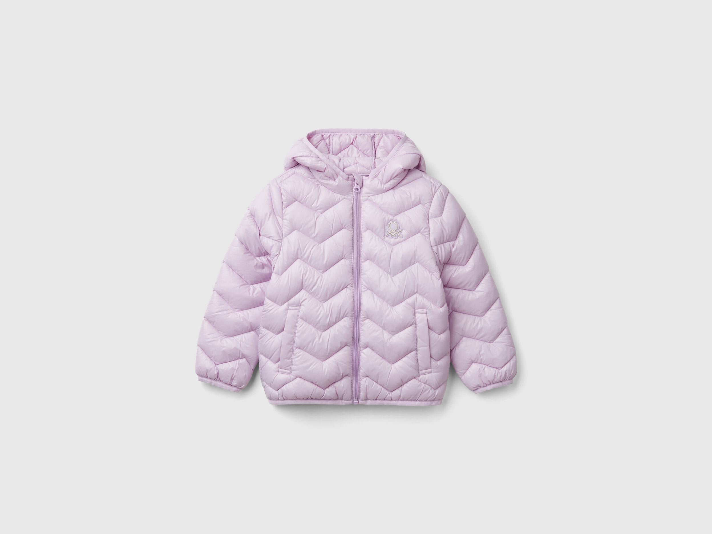 Front view of a light pink padded jacket with a hood for a girl.