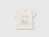 Front view of an off-white T-shirt for kids in Kuwait, featuring adorable graphic prints of cartoon dinosaurs and a palm tree, perfect for casual wear.