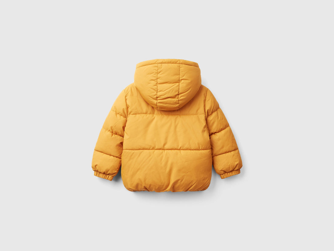 Back view of a mustard yellow hooded Teddy Jacket for kids, showing its plush exterior and comfortable design, ideal for children in Kuwait.