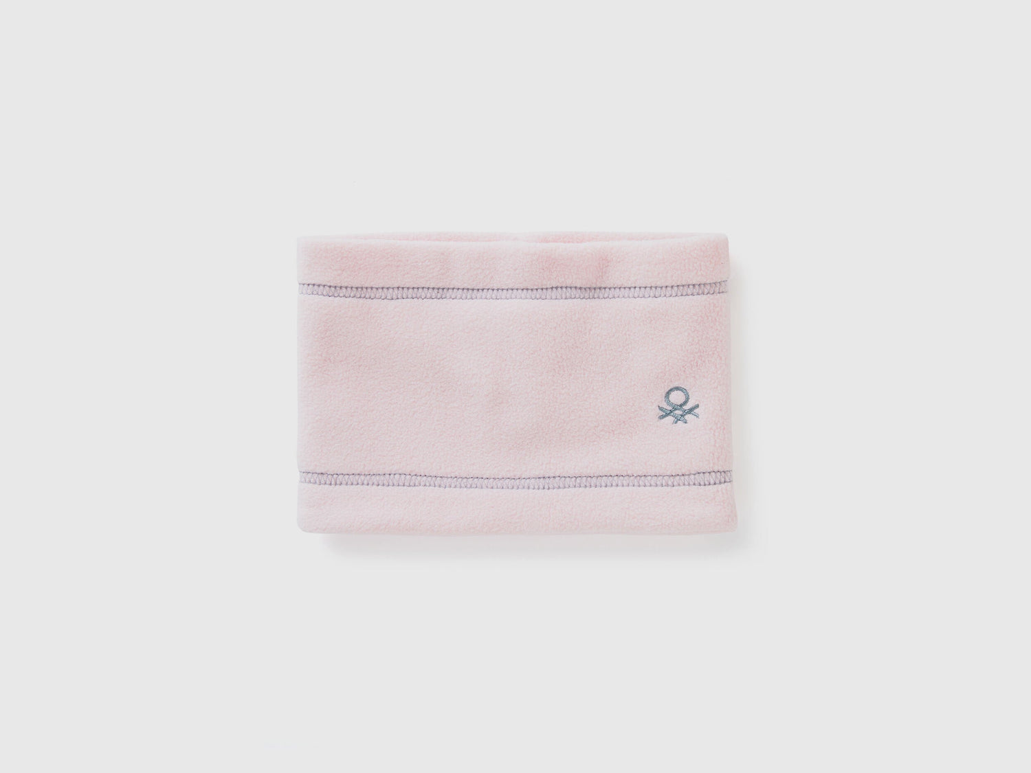 Light pink fleece neck warmer, folded flat with logo.