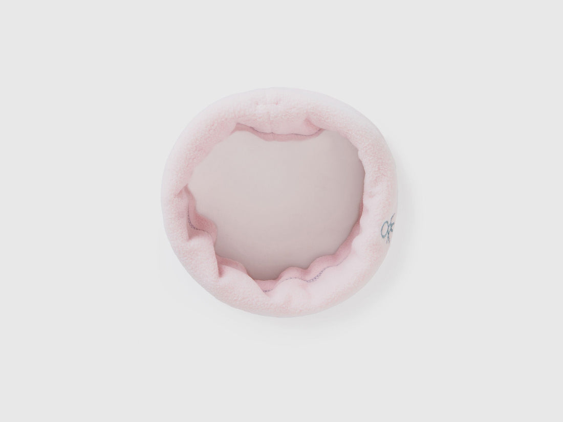 Light pink fleece neck warmer, rolled for soft comfort.