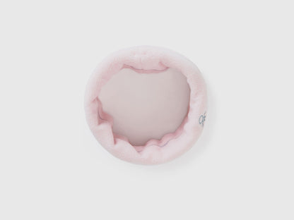 Light pink fleece neck warmer, rolled for soft comfort.