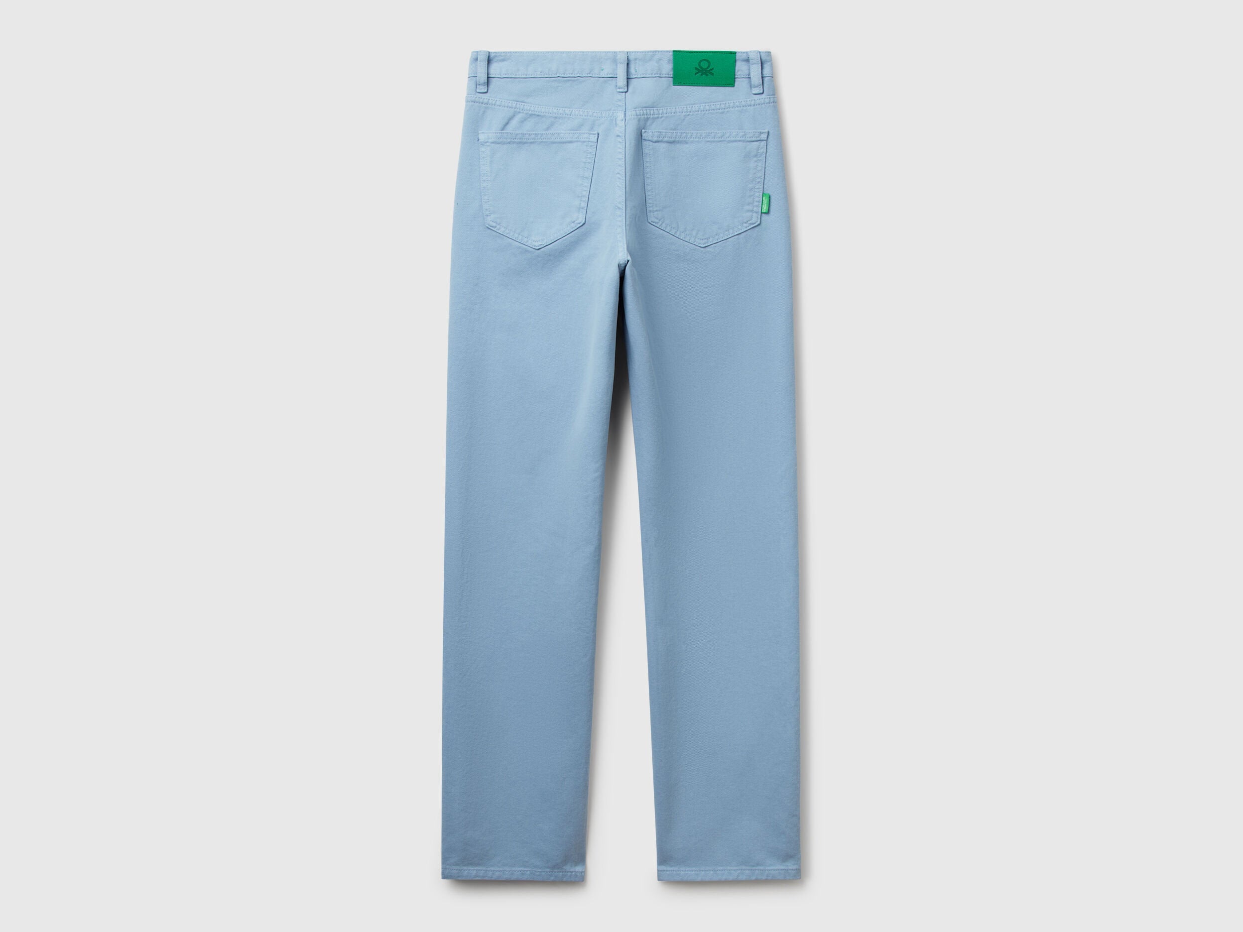 Back flat lay of light blue women straight leg jeans in blue colour, showing the rear pocket design and comfortable fit, a great option for casual wear in Kuwait.
