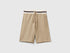 Front view of lightweight beige sweat shorts with a striped waistband.