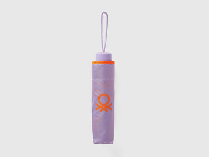 Folded lilac Benetton umbrella, compact for portability.