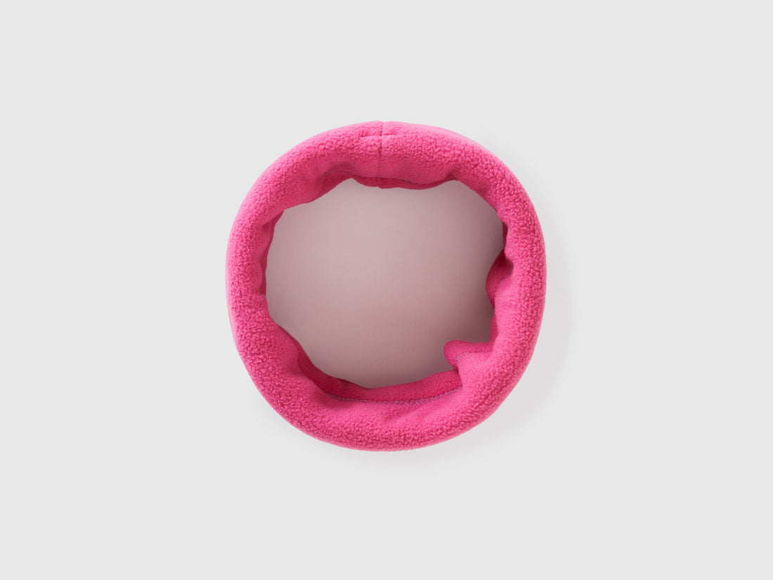 Magenta fleece neck warmer, rolled for warmth and style.