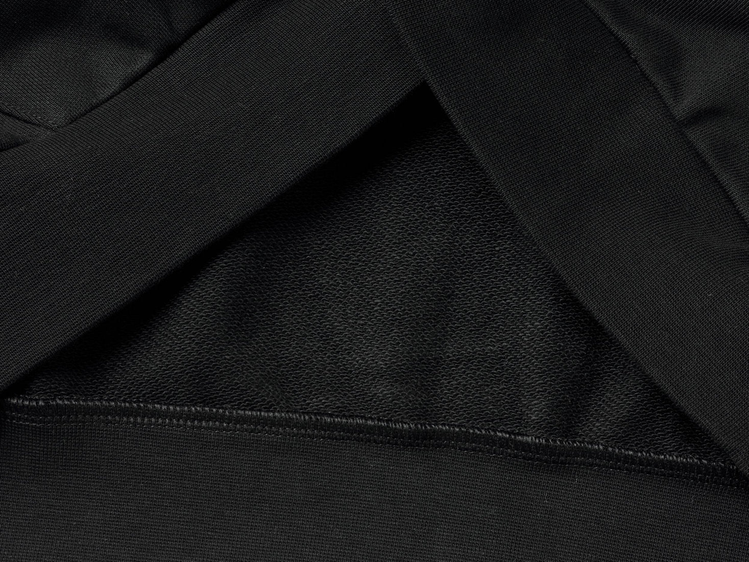 Flat lay back view of a black pullover hoodie for men.