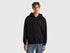 Front view of a man wearing a black hoodie with drawstring hood.