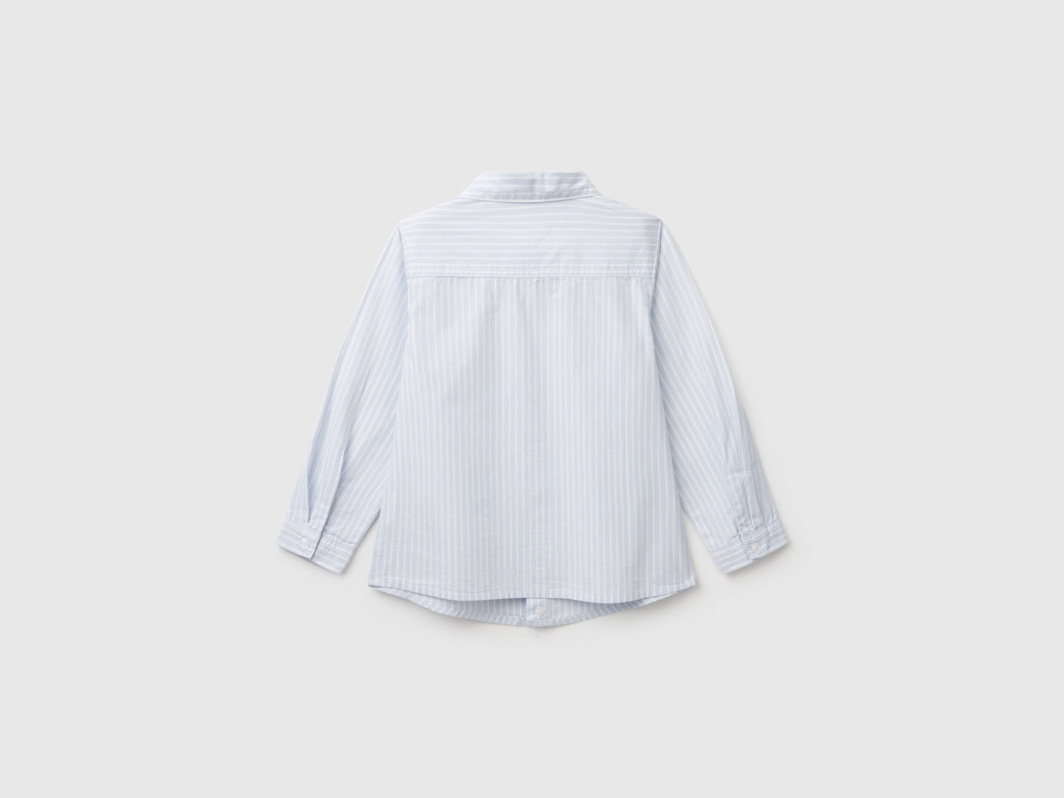 Back view of a white and blue striped shirt for men or boys in Kuwait.