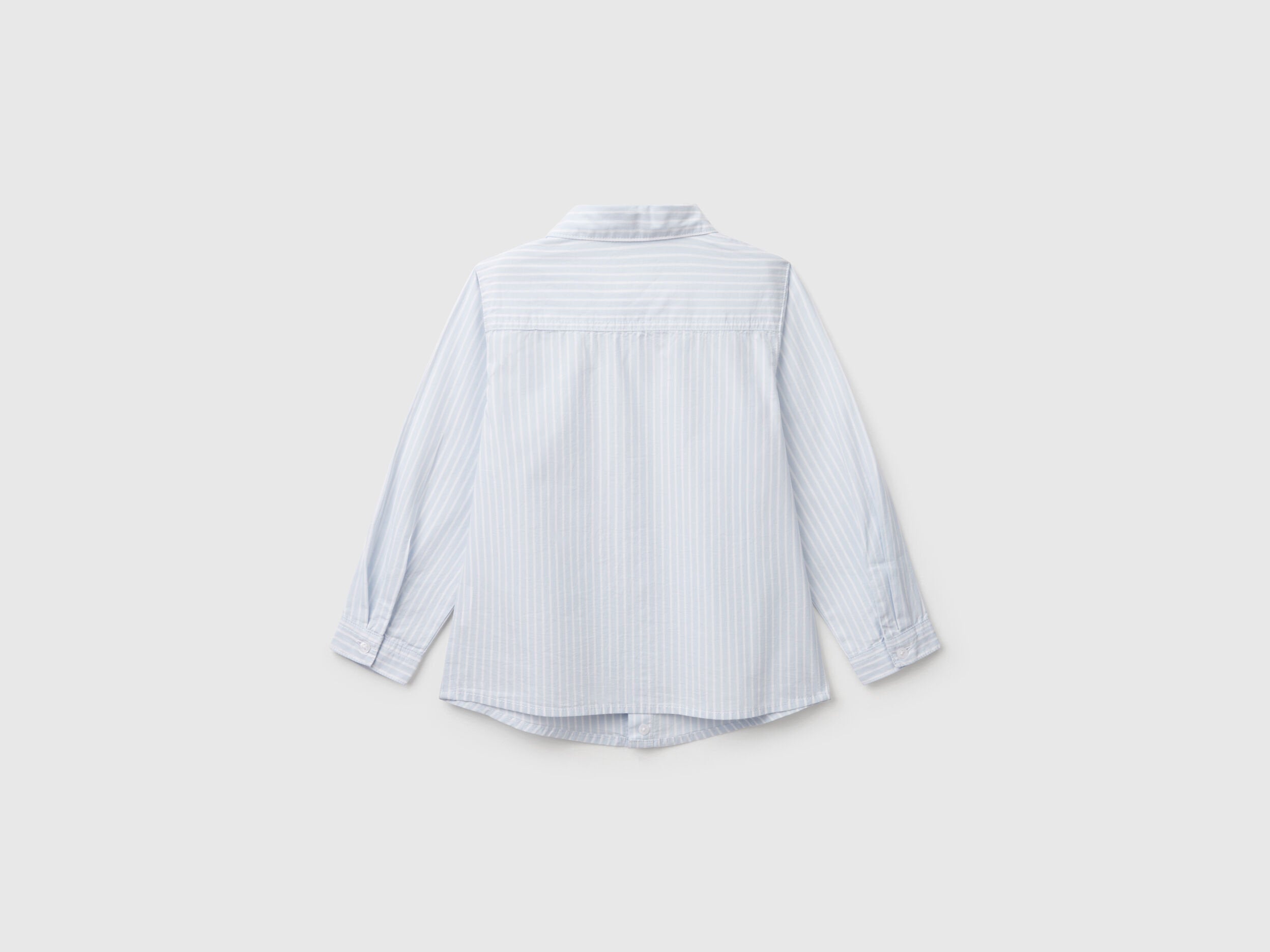 Back view of a white and blue striped shirt for men or boys in Kuwait.