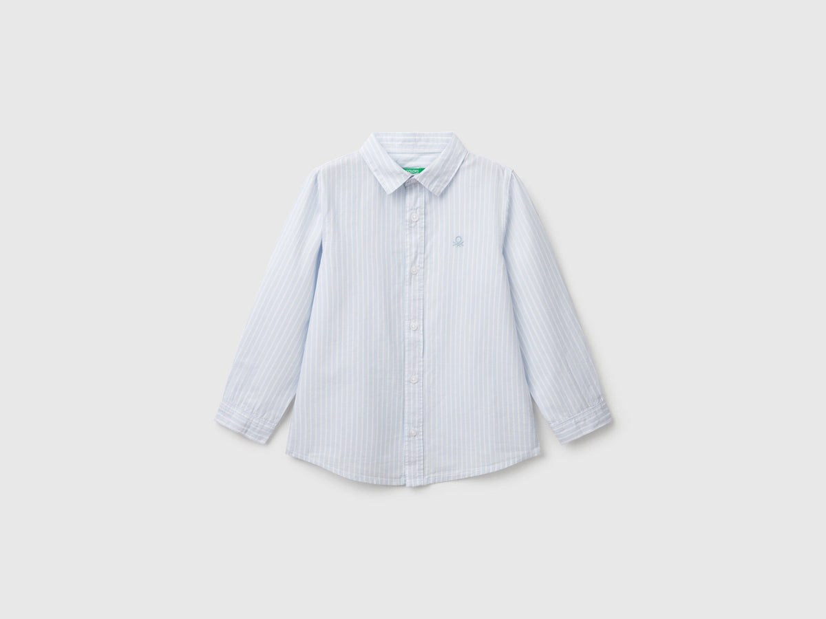 Front view of a white and blue striped shirt for men or boys in Kuwait.
