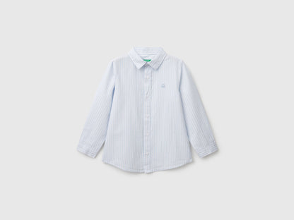 Front view of a white and blue striped shirt for men or boys in Kuwait.