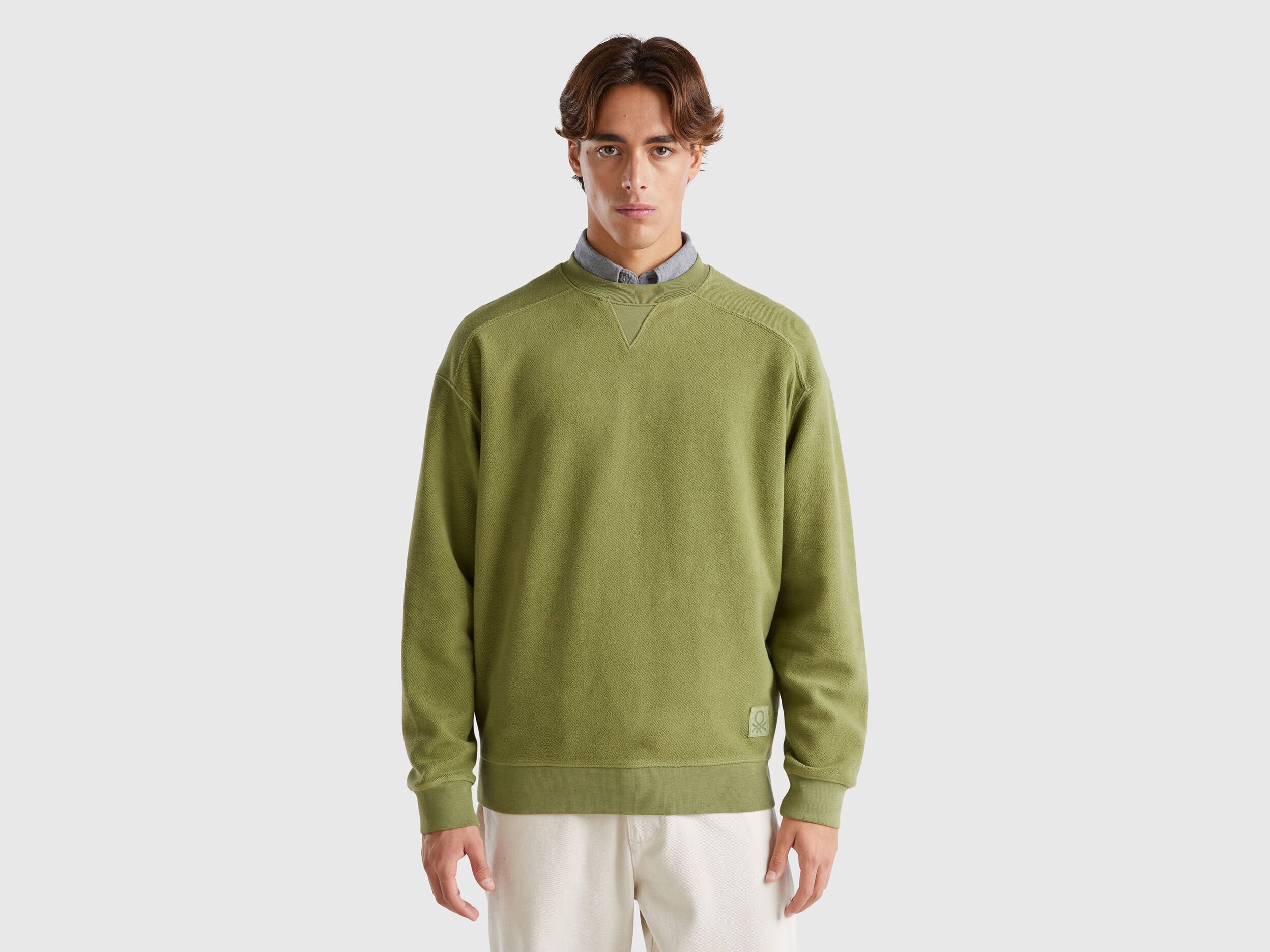 Front view of a dark green cotton sweatshirt for men.