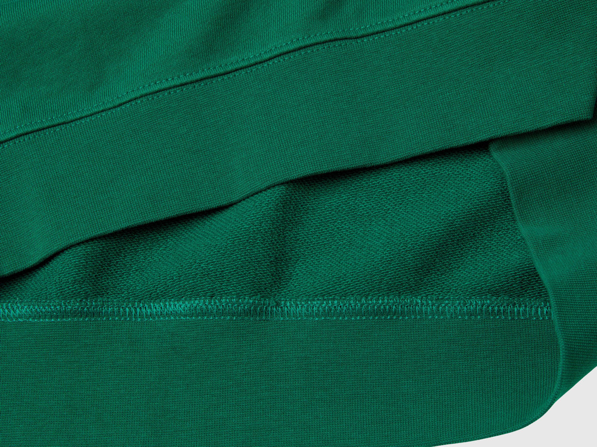 Flat lay back view of a green crew neck sweatshirt for men.
