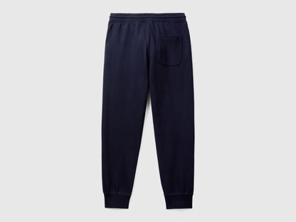 Close-up of the elasticated waistband and drawstring of dark blue men&