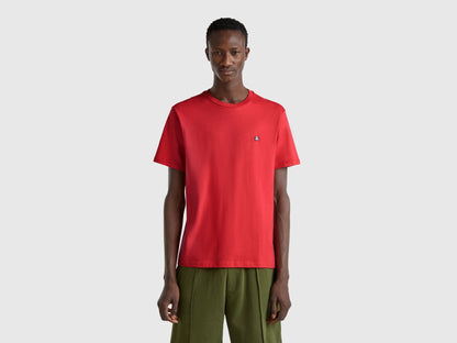 Front flat lay of a classic red short-sleeve T-shirt for men in Kuwait, featuring a ribbed crew neck, a versatile wardrobe staple.