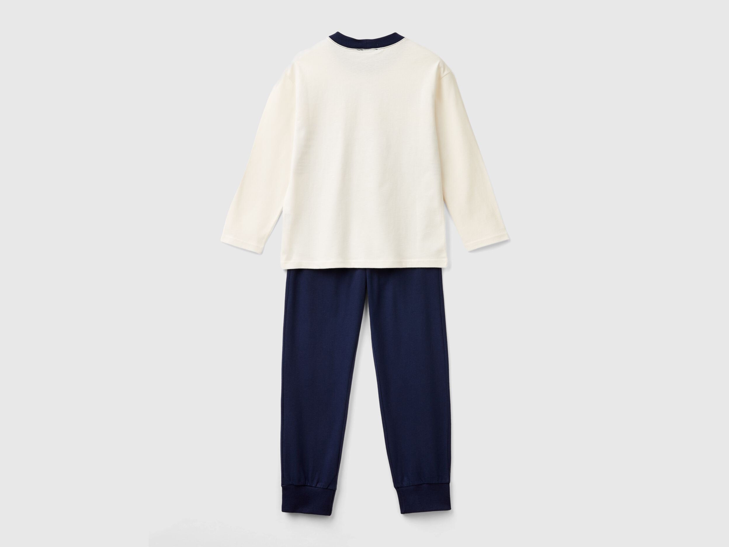 Back view of a simple, long-sleeve, white cotton top and plain navy blue bottoms, forming a basic yet comfortable set of pyjamas Kuwait for men&