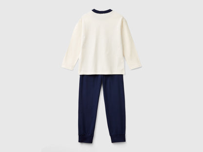 Back view of a simple, long-sleeve, white cotton top and plain navy blue bottoms, forming a basic yet comfortable set of pyjamas Kuwait for men&