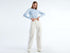 Model showcasing the stylish fit of beige wide-leg cargo pants, a trending fashion item in Kuwait.
